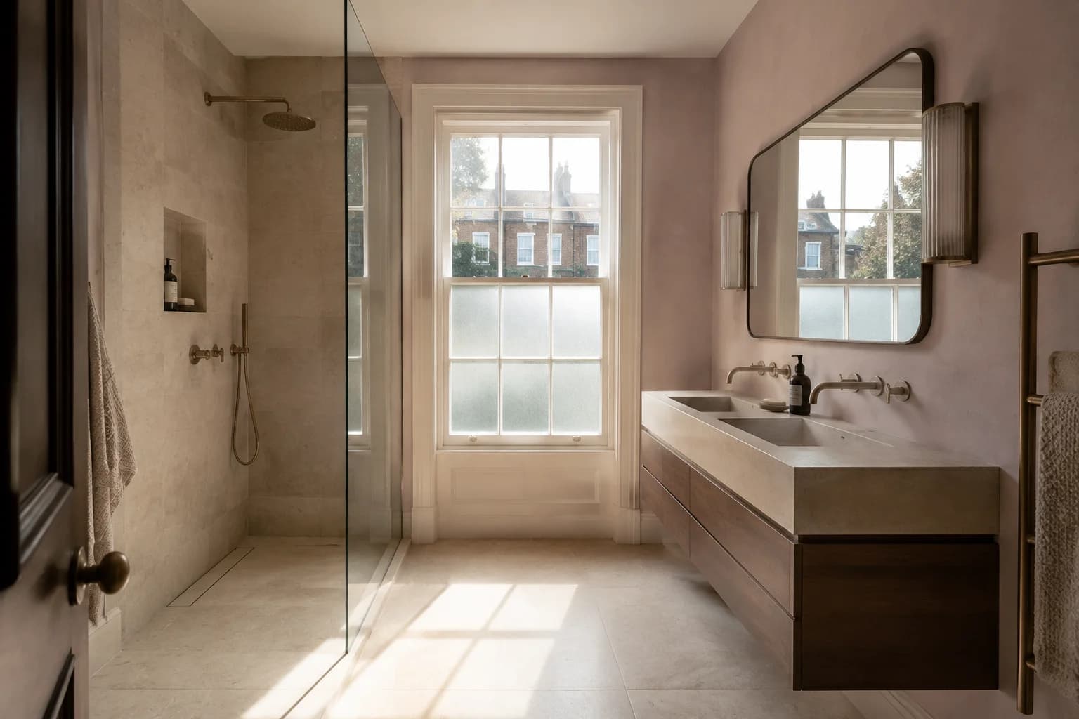 Concept bathroom renovation with limestone surfaces, a walnut vanity, bronze fittings and a sash window